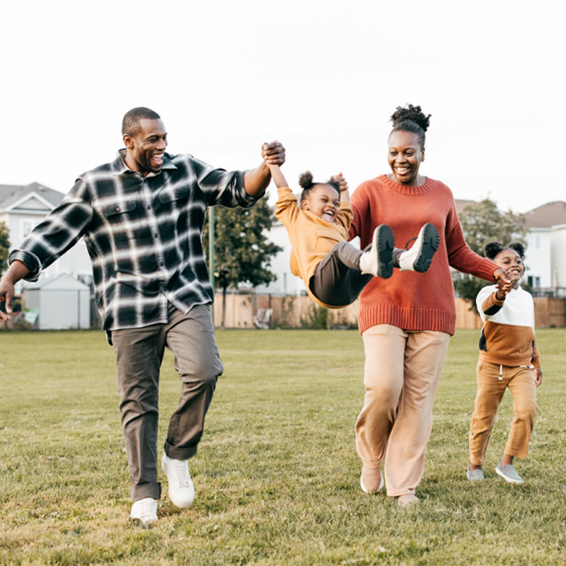 family playing in yard